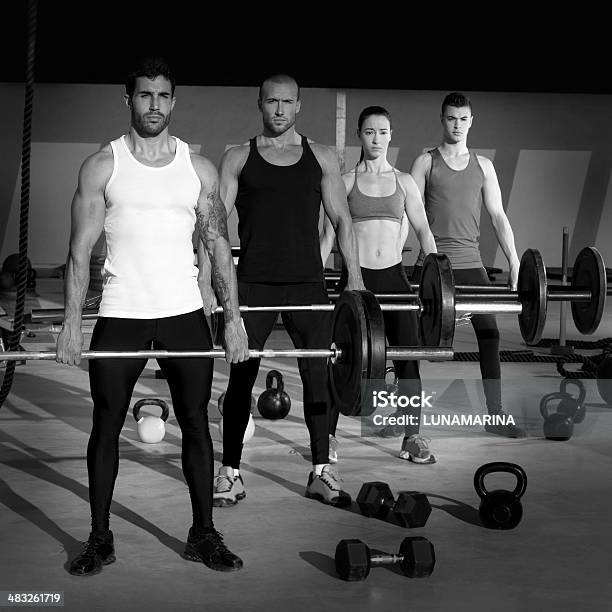 Gym Group With Weight Lifting Bar Gym Workout Stock Photo - Download Image Now - 20-29 Years, Active Lifestyle, Activity