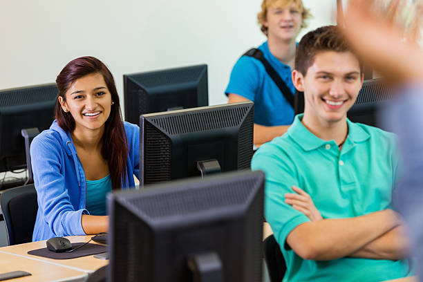 istock Students in computer lab listening to high school teacher 483262479