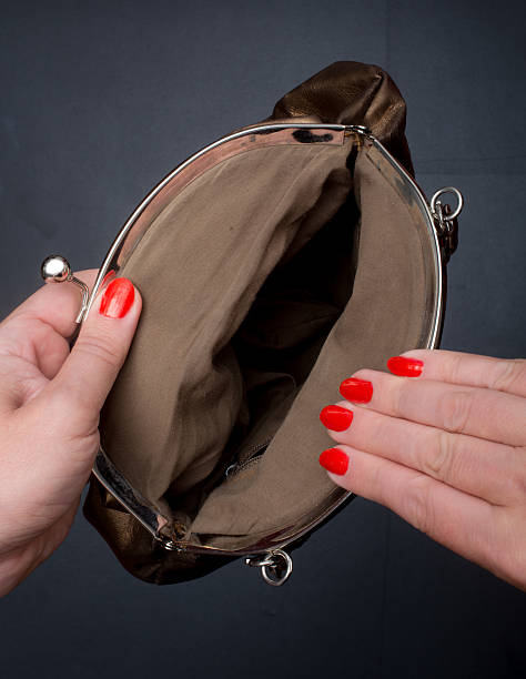 istock close up hand opening empty gold Handbag 483262534