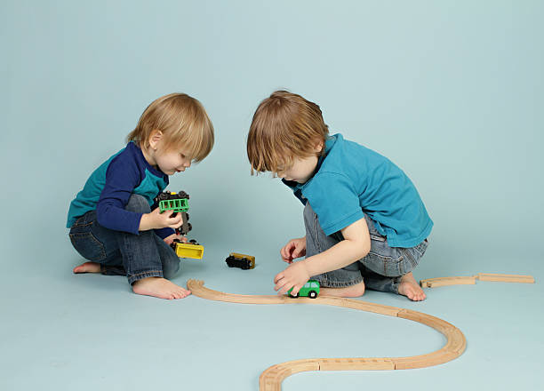 istock Kids playing with toy trains 483262895