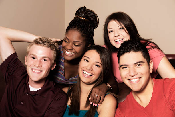istock Relationships: Five, multi-ethnic friends hang out together. 483263117