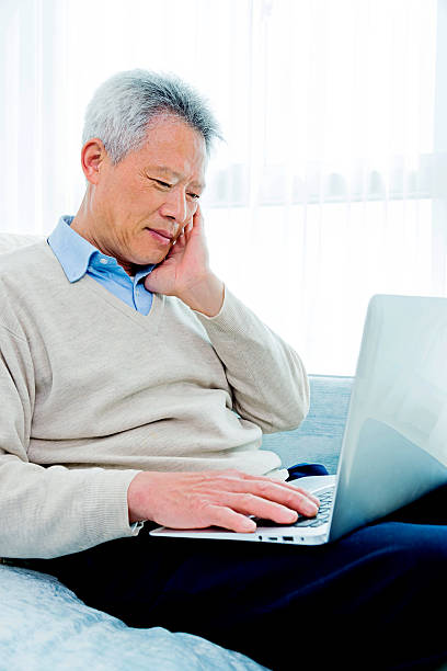 istock Senior asian man working on laptop 483263798