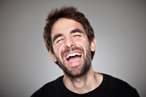 istock Portrait of a normal boy laughing isolated on white 483263817