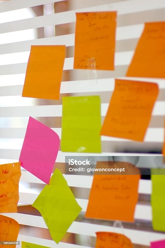 post it reminders in office post it reminders stick in office Adhesive Note Stock Photo