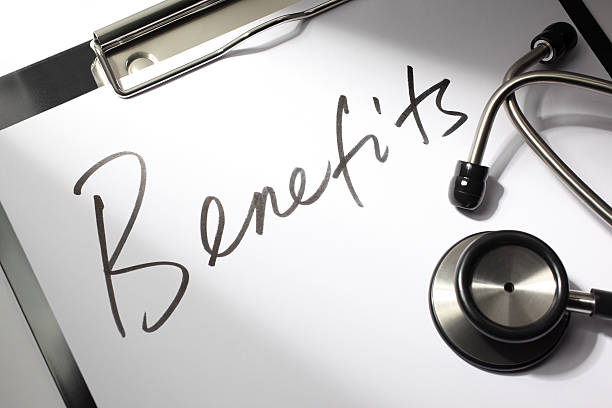 Healthcare Benefits Healthcare concept. "Benefits" written on a doctor's clipboard with stethoscope. benefits stock pictures, royalty-free photos & images