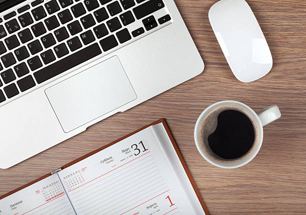 istock Notepad, laptop and coffee cup on wood table 483264913