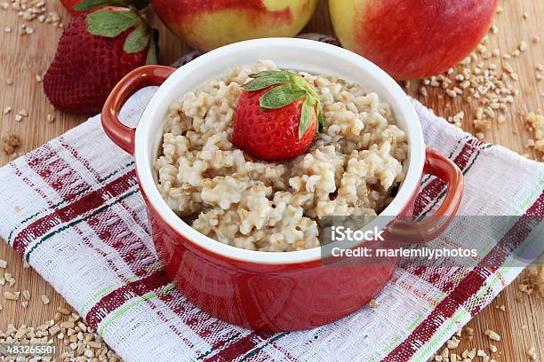 Oatmeal With Apples And Strawberries Stock Photo - Download Image Now - Apple - Fruit, Berry Fruit, Bowl