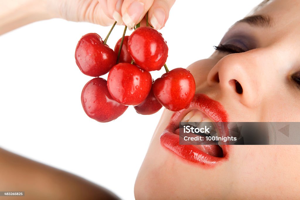 Fresh Cherries Young woman eating fresh cherries Adult Stock Photo