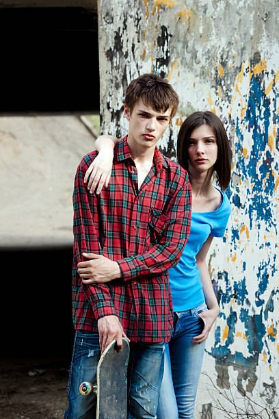 two teenager with a skateboard