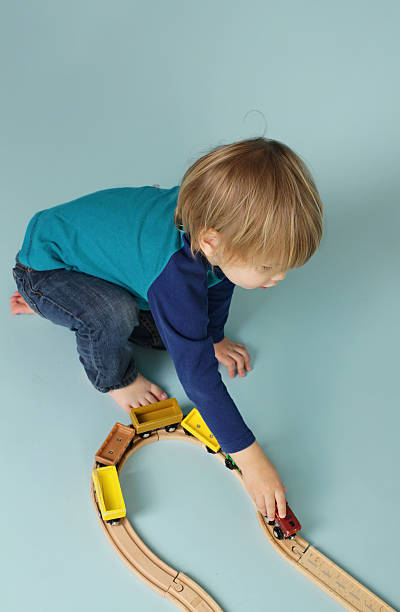 istock Kids playing with toy trains 483266445
