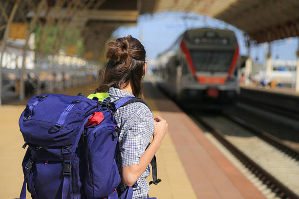istock backpackers girl waiting for the train 483270170
