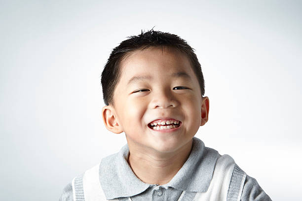 istock little boy smile close up 483271402