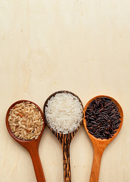 istock Rice spoon with space on wood background 483276822