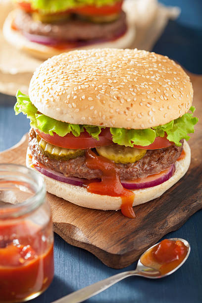 istock burger with beef patty lettuce onion tomato ketchup 483280038