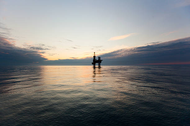 istock Silhouette of drilling rig at sunset 483282148