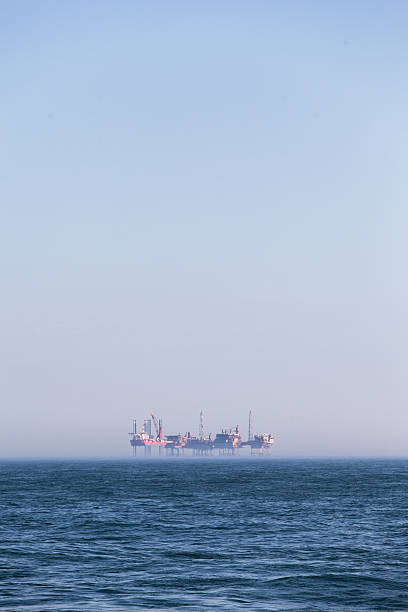 istock Oil platform in the fog 483284044