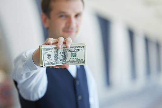 istock closeup money in male hands 483284284