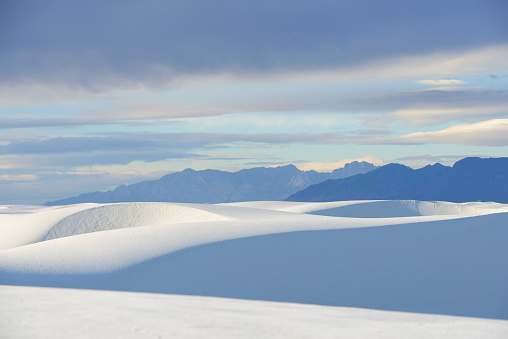 Soft light at sunrise illuminating the sand dunes at White Sands National Monument in New Mexico.