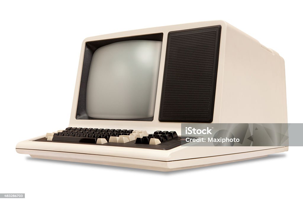Vintage old computer, rounded monitor, keyboard, eighties revival, white background Vintage old computer from the eighties, with integrated monitor and keyboard. Retro revival style with rounded corners, right side low angle view, isolated on white background with clipping path. Computer Stock Photo