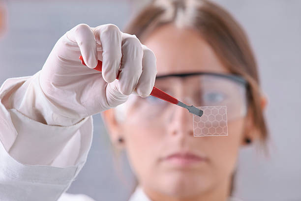 Scientific showing a piece of graphene with hexagonal molecule.