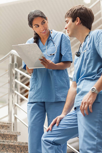 istock Nurse holding a notepad on stairs 483288383