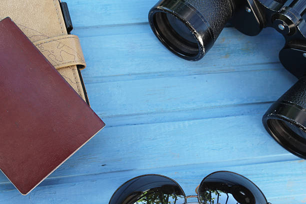 istock Preparation for travel - binoculars, sunglasses, passport and notebook 483289000