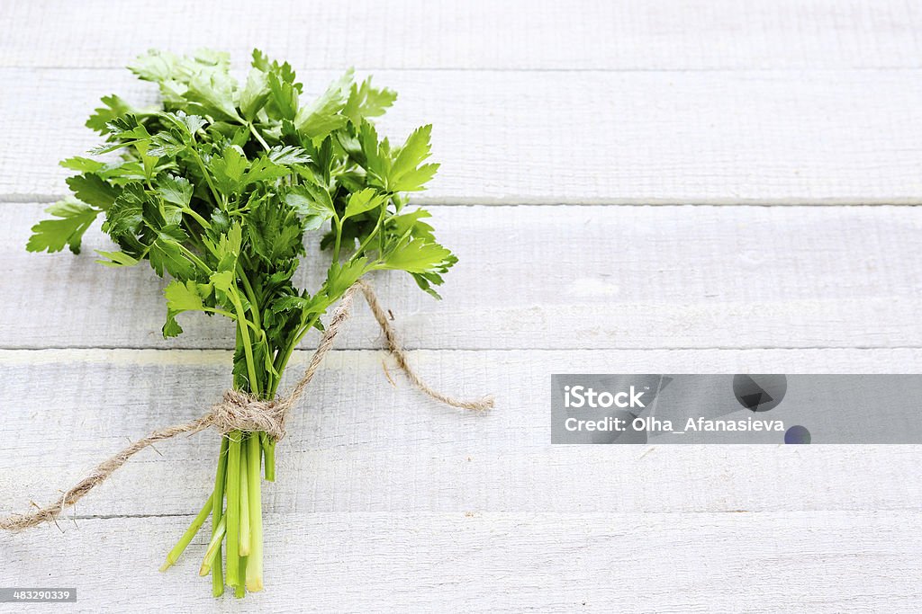 bunch of parsley on white boards bunch of parsley on white boards, food Backgrounds Stock Photo