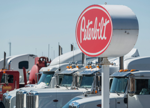Dartmouth, Canada - March 24, 2014: A row of new semi trucks at a Peterbilt dealership in Burnside Industrial Park.