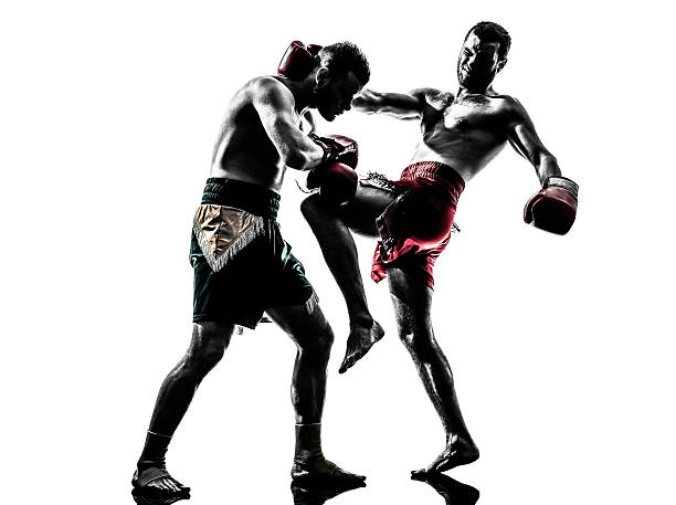 istock two men exercising thai boxing silhouette 483292245