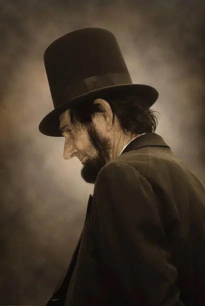 Sepia tone photo of Abraham Lincoln in profile
