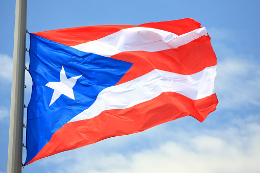 Flag of  Puerto Rico against the sky
