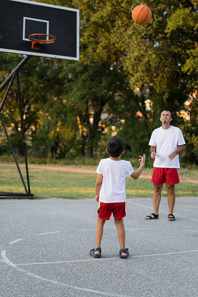 istock Father and son playing basketball 483297966