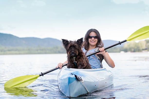istock Young Woman Kayaking with her Dog 483302034