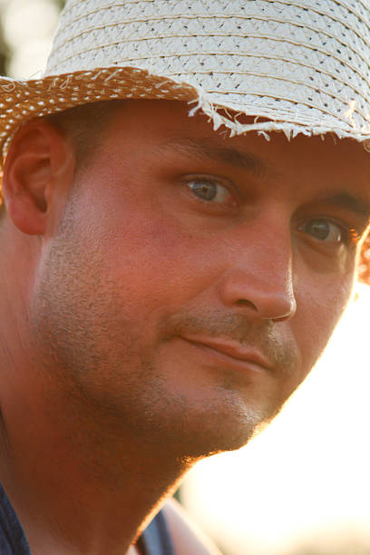 istock Close-up View of Man Wearing Straw Hat Posing For Camera 483302208