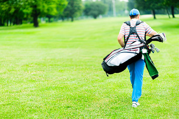 istock Golfer carrying his equipment 483303236