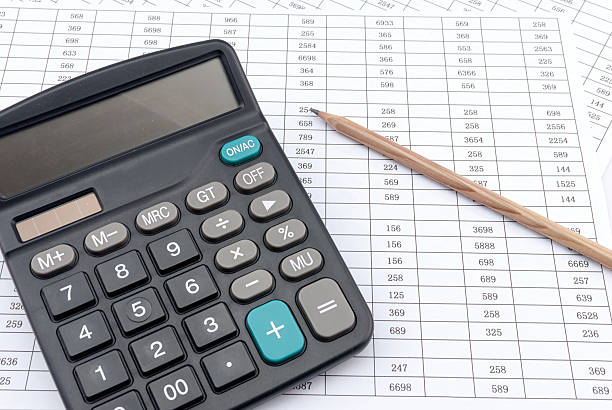 istock calculator and pen on a white background 483303886