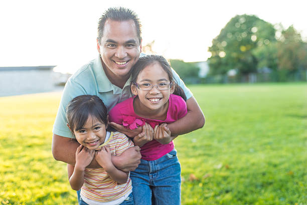 istock Father and Daughters at the Park 483307416