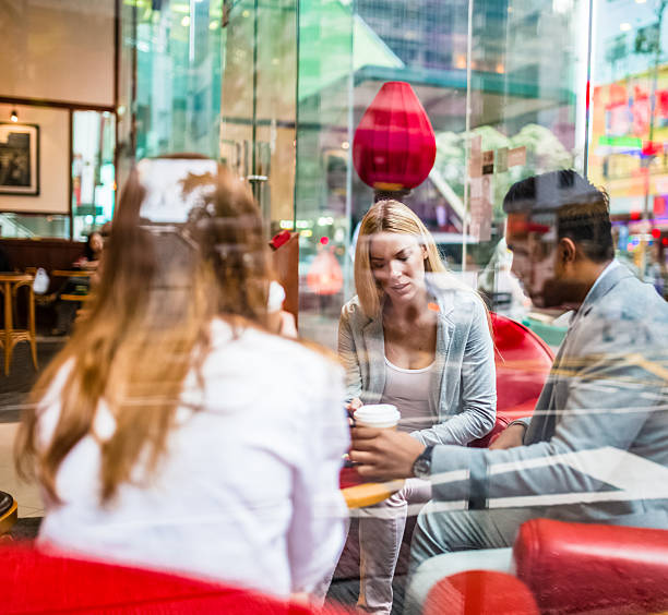 istock Three friends in Hong Kong cafe 483307616