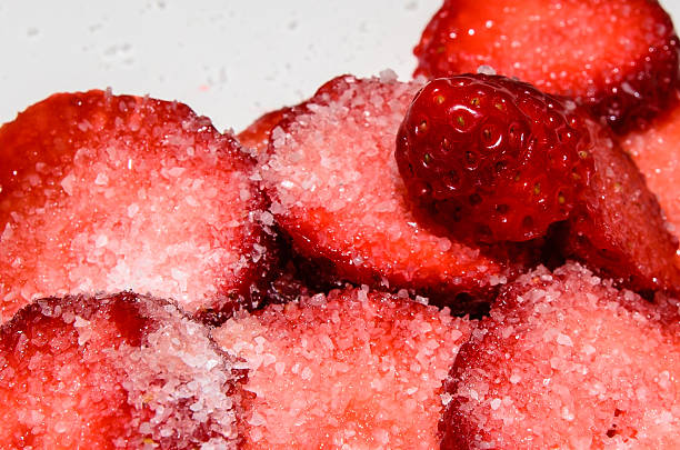 Sliced strawberries with sugar stock photo