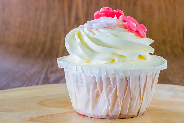 istock Tasty cupcakes in wood plate 483316488