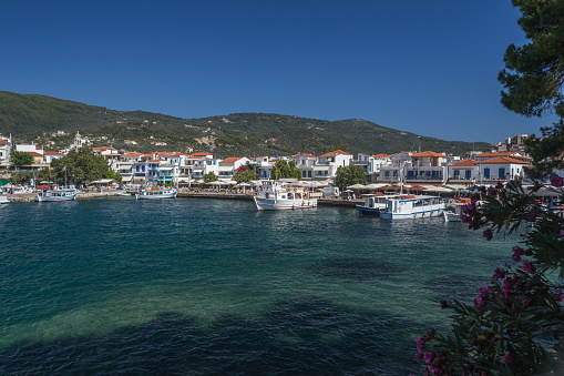 Skiathos, Greece - July 23, 2015: View of tourist and pleasure boats moored in the Old Port bay of Skiathos, Greece
