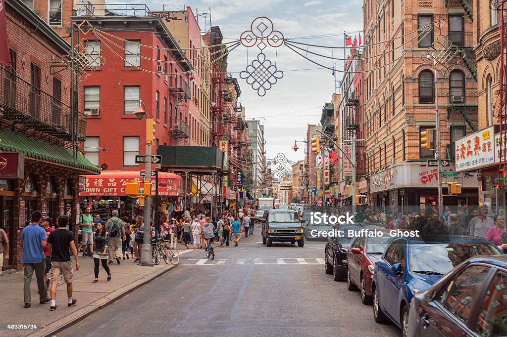 Chinatown, Manhattan, New York City Lovely view of one of the most renowned streets in Chinatown (Mott St), with it's busy shops crowded with tourists strolling on a summer day. New York City Stock Photo