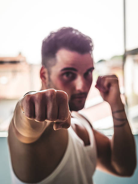 młody człowiek pociągając za rejestrację (edit punch - punching young adult boxer boxing zdjęcia i obrazy z banku zdjęć