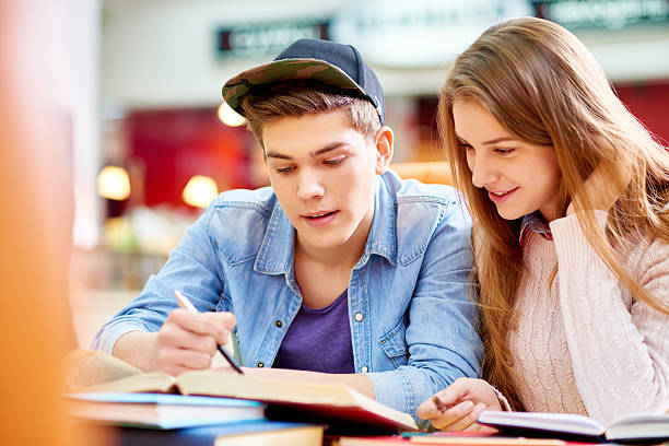 istock Teenagers in library 483317278