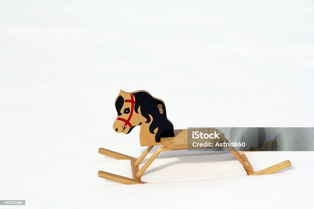 rocking horse the forgotten rocking horse in the snow Activity Stock Photo
