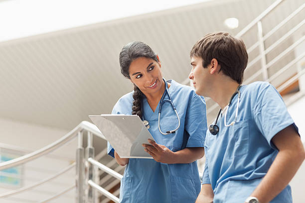 istock Nurse holding a clipboard on stairs 483317871