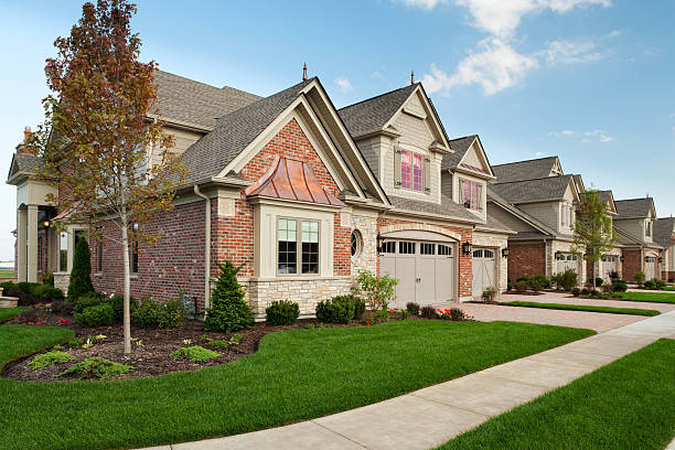istock Upscale town homes set against a clear blue sky 483320273