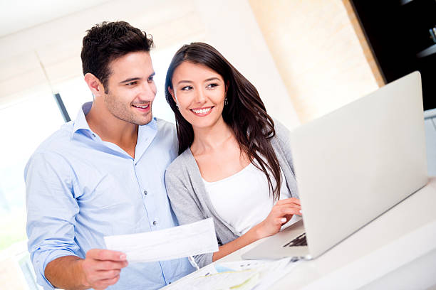istock Couple paying bills online 483321235