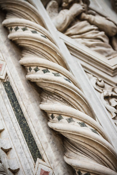 Detail of one toroidal column of the right portal of the cathedral of Florence in Italy.