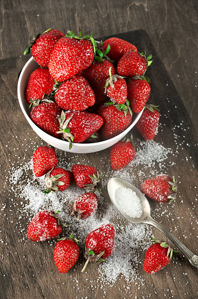 istock Strawberries in bowl with sugar 483322600